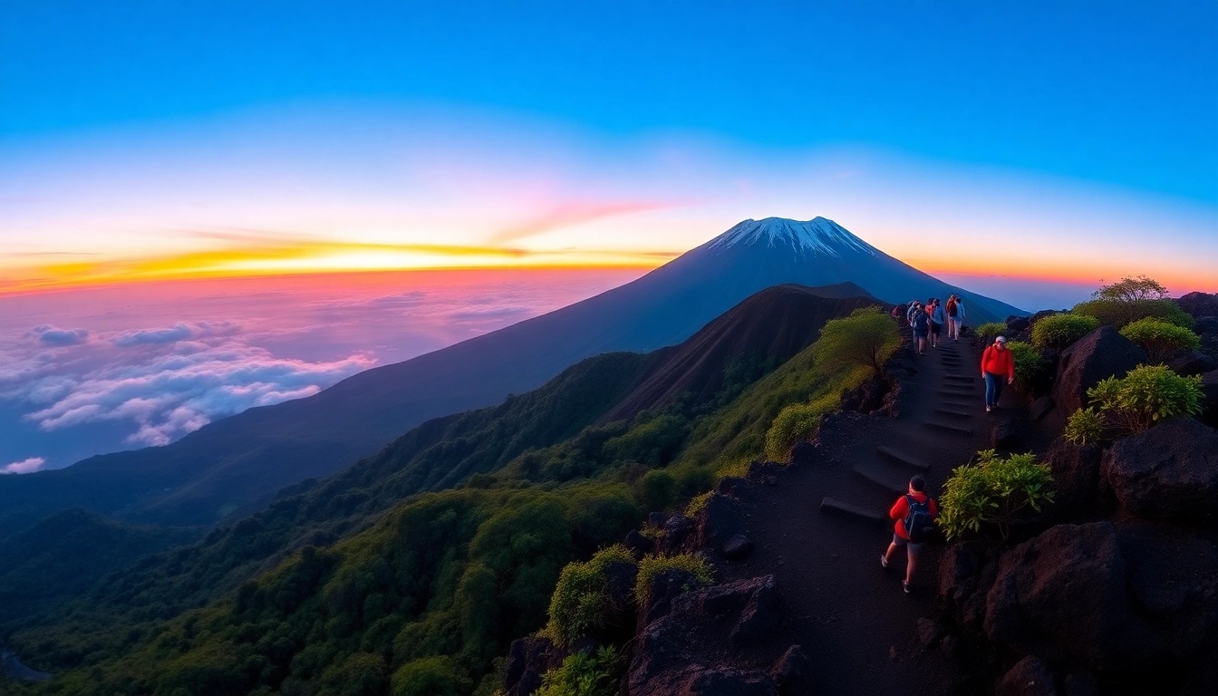 Hikers ascending Mount Rinjani at sunrise with vibrant sky and lush landscape